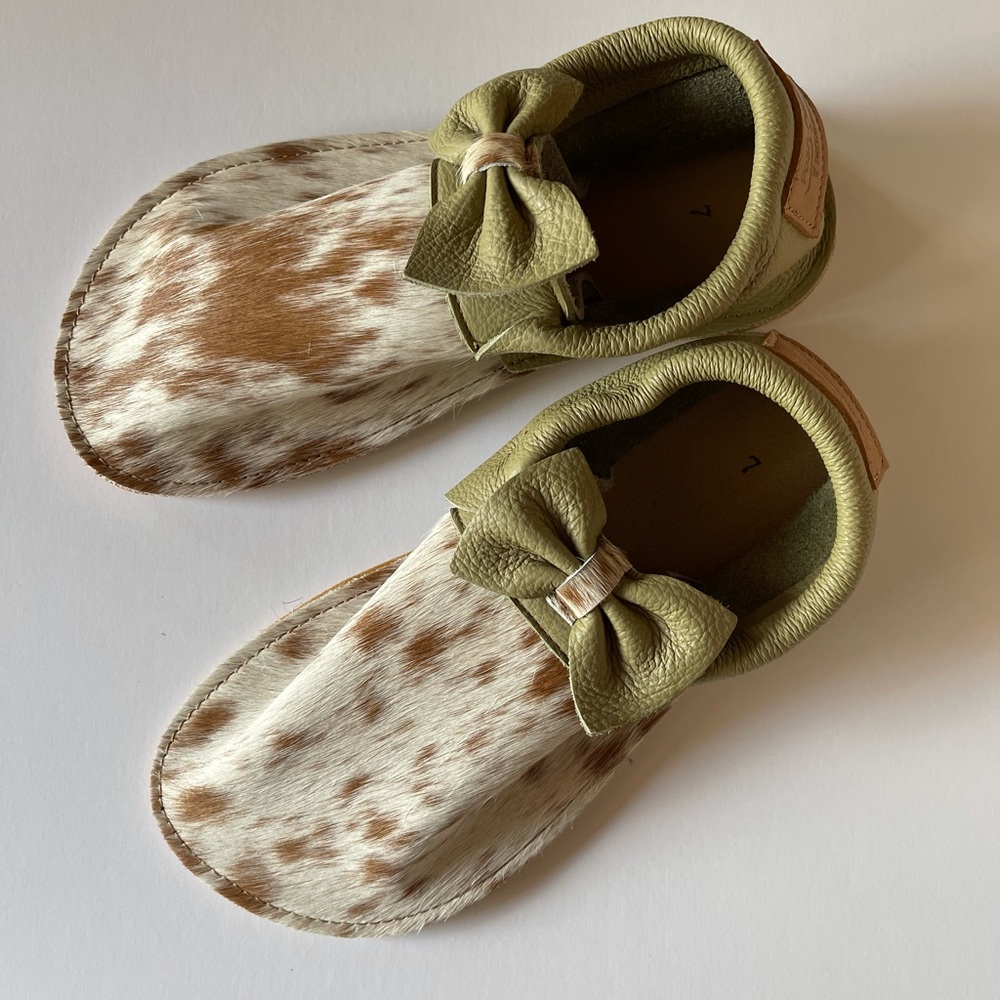 Posh Panda Hair on Hide Moccasins with Green Bow
